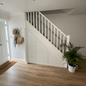 White bespoke under stairs storage installed in Milton Keynes by Pro Spaces
